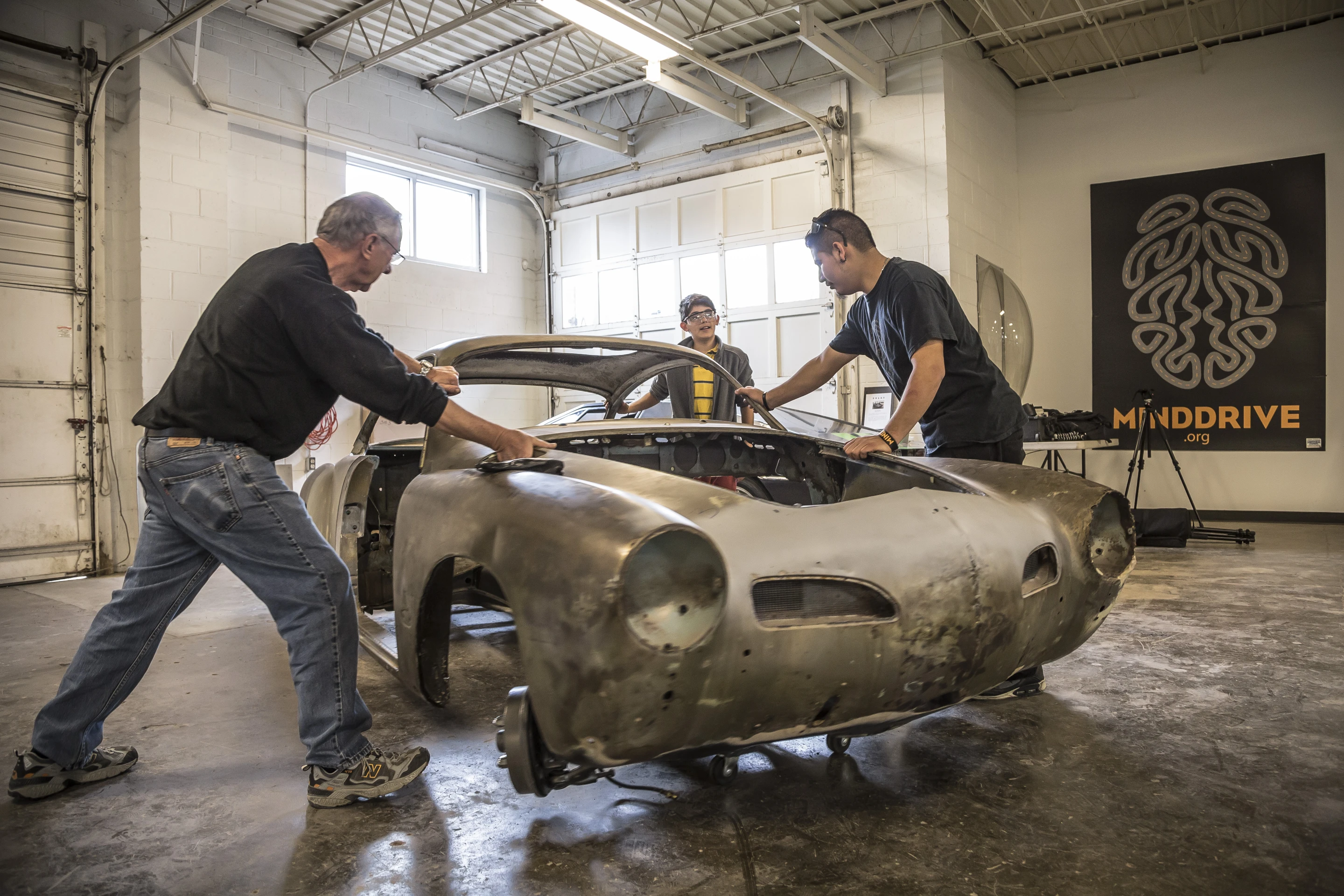 The once battered, rusty shell of a 1967 VW Karmann Ghia is whipped into shape