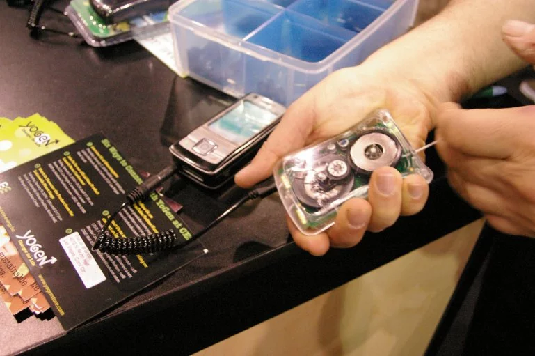 The YoGen charger shown here at CES 2010, uses your energy to power the batteries of most portable electronic devices