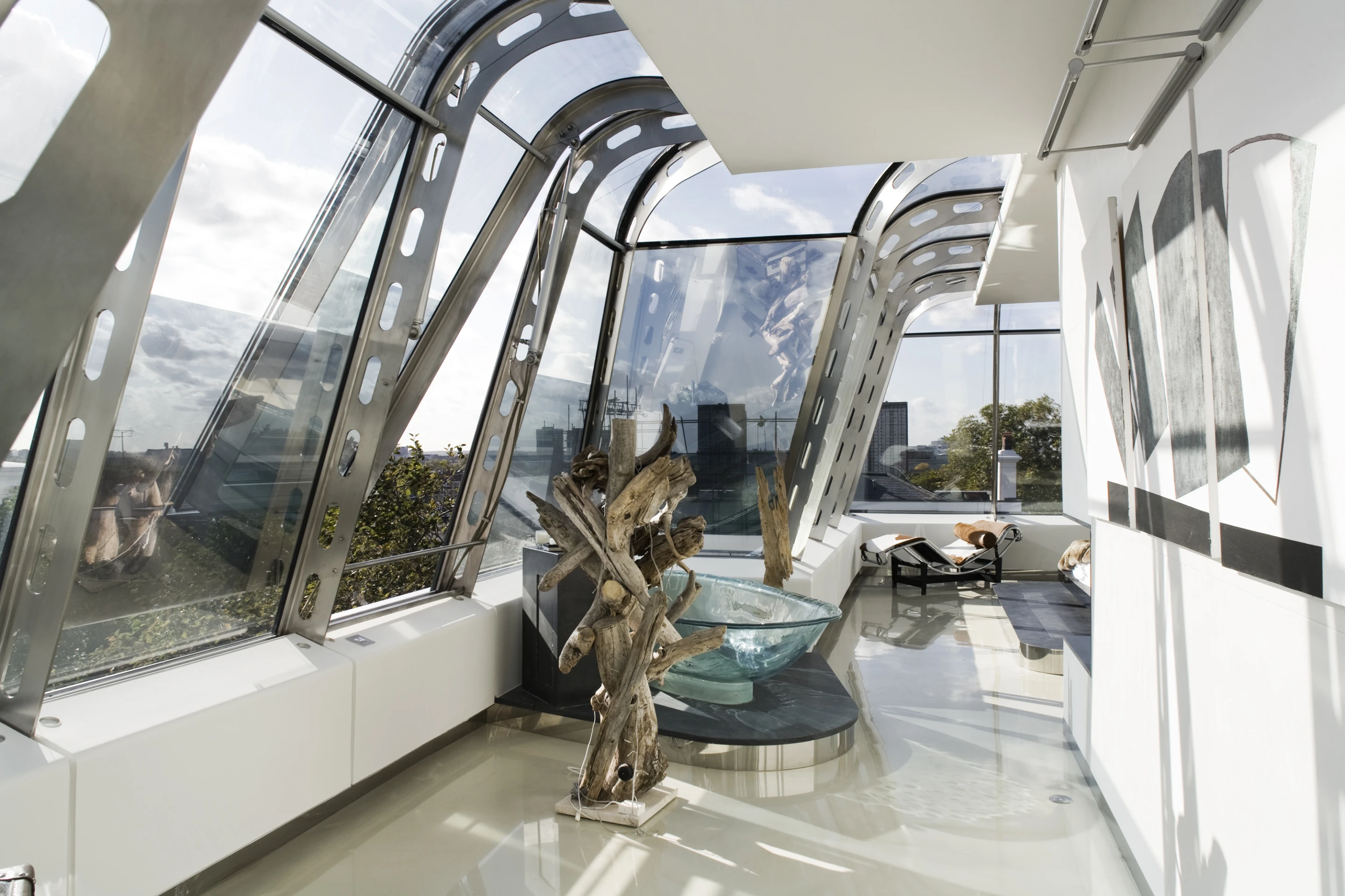 The issue of the two buildings being physically separated was elegantly solved by employing a two-story glass bridge