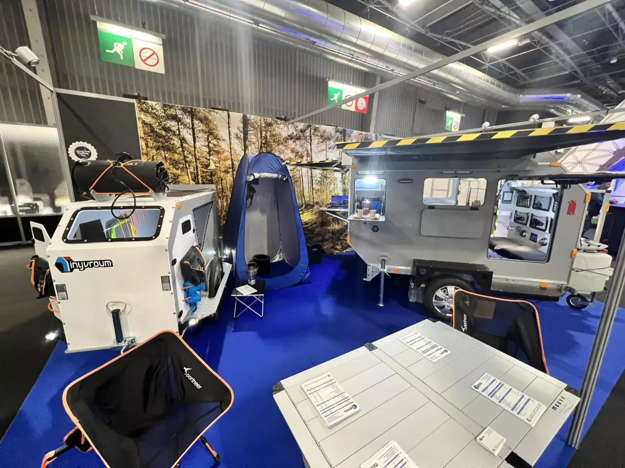 TinyVroum shows the privacy tent and pack-away kitchen equipment