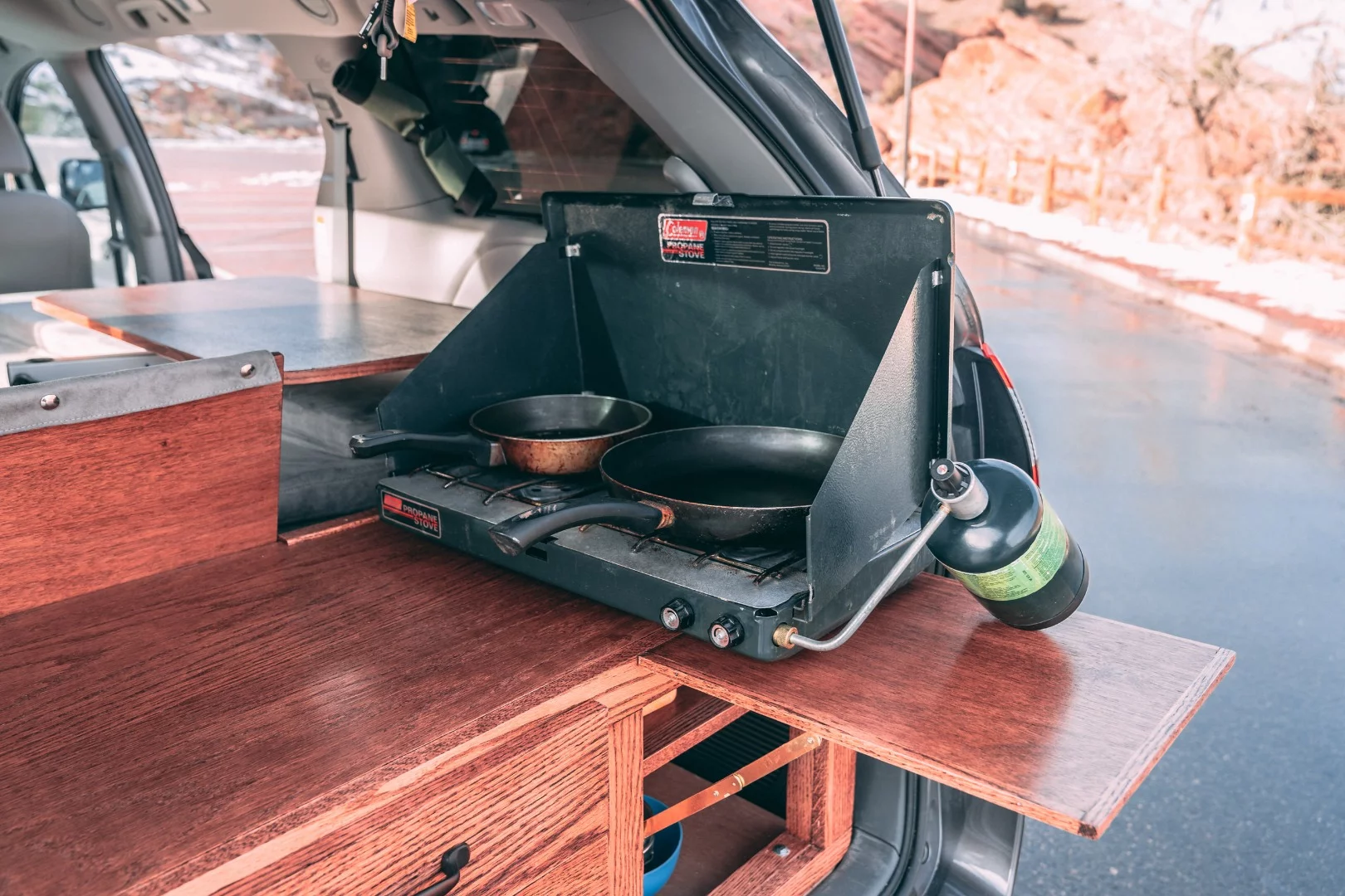 There's no hard-plumbed cooktop, but the countertop extension can hold a portable camping stove