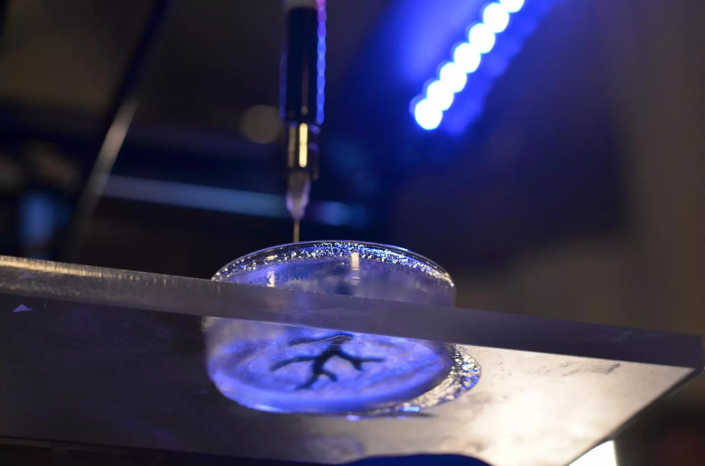 A 3D printer uses a syringe to inject printing gel into a translucent support gel