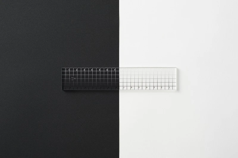 This ruler uses graded markings for use on dark or light surfaces