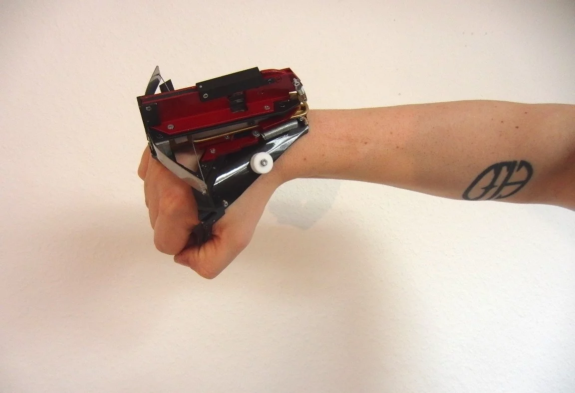 The WristBow Mk II stores multiple carbon fiber darts in its ammo clip, which drop into place as needed