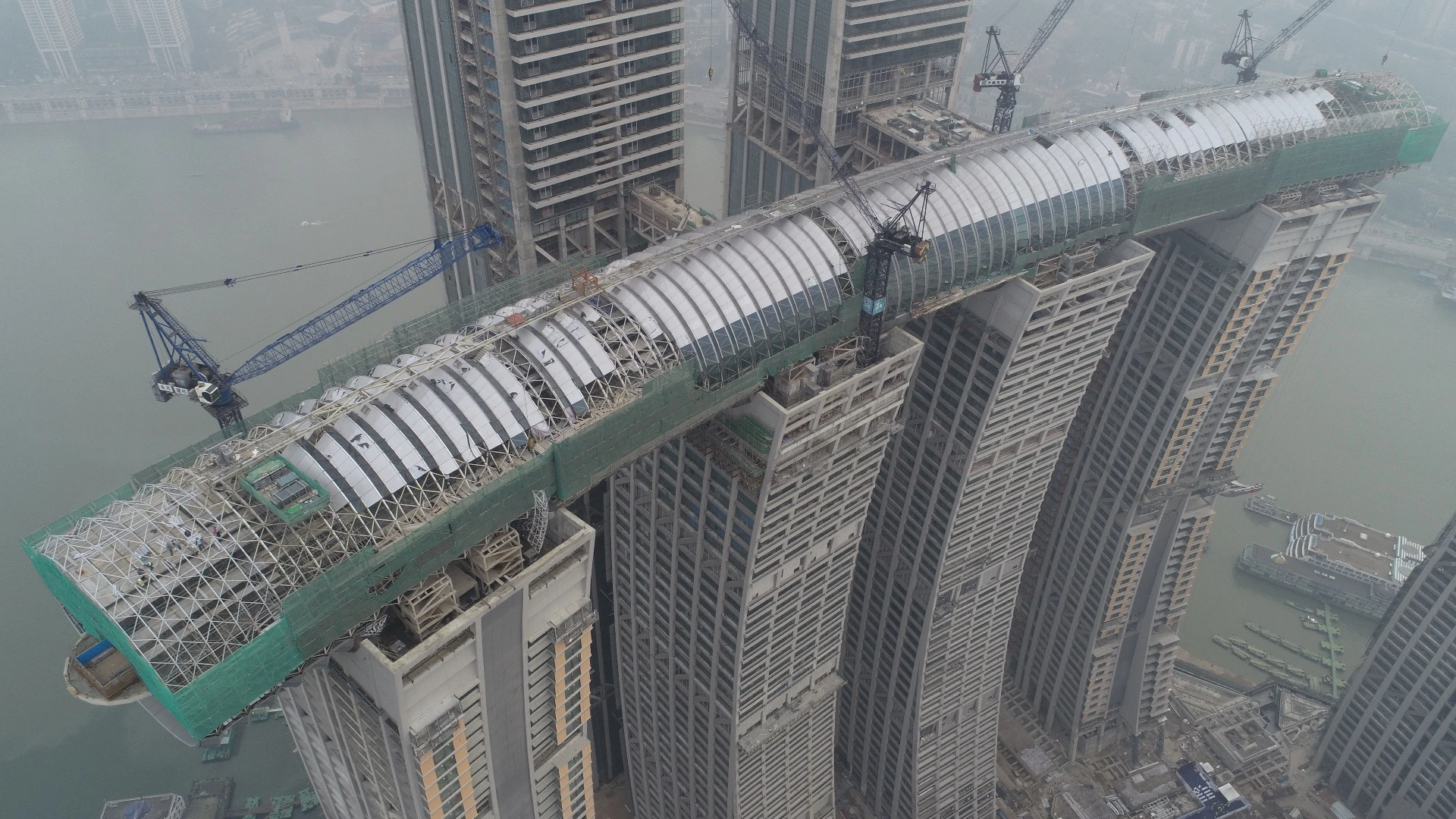 Raffles City Chongqing's horizontal skyscraper, by Moshe Safdie, is officially named the Crystal and measures 300 m (984 ft) in length