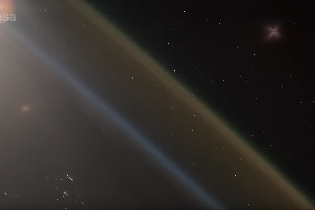 The ascending Soyuz rocket can be seen in the upper right-hand corner