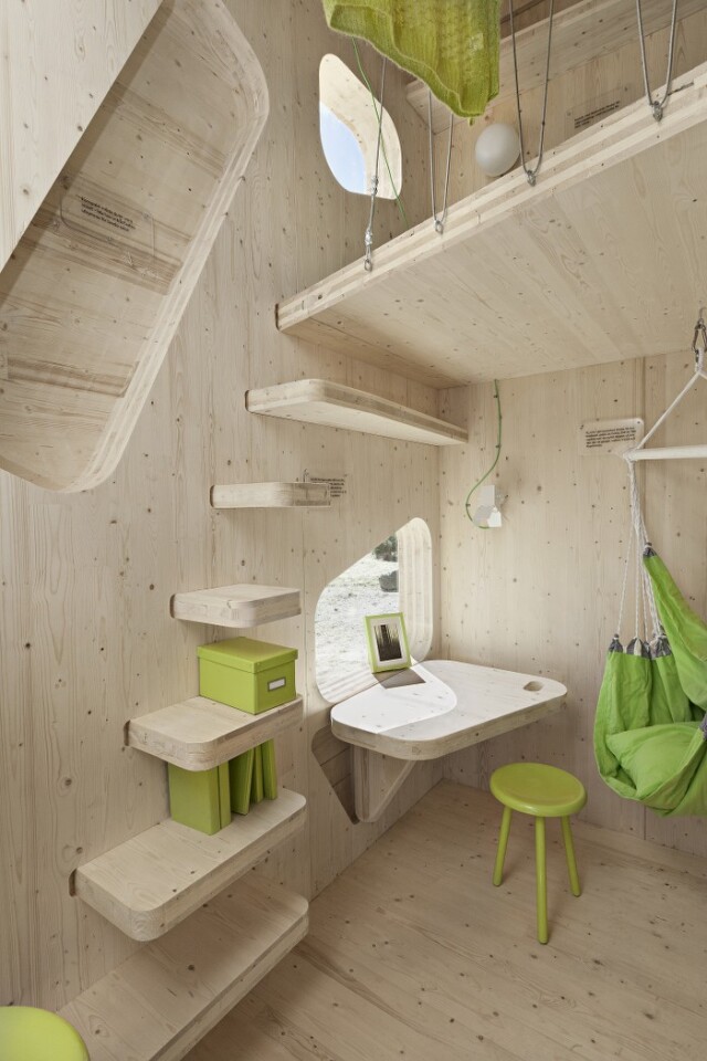 “Smart” features have been built into the structure; for example the desk doubles as a window shutter and the wall shelves can be used as steps