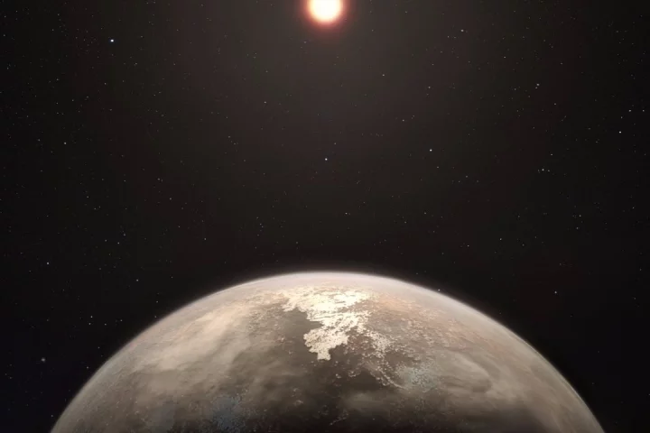 Artist's impression of Ross 128 b, which was discovered orbiting a red dwarf star – the most common type of stellar body in the universe