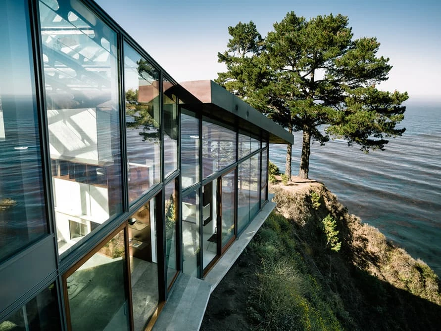 The north-facing facade is all glass and offers amazing views of the famous coastline