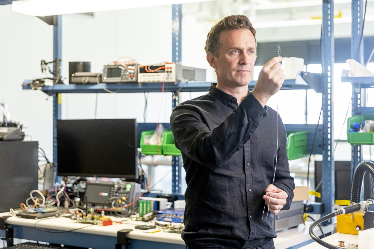 Synchron's Thomas Oxley holds up a Stentrode