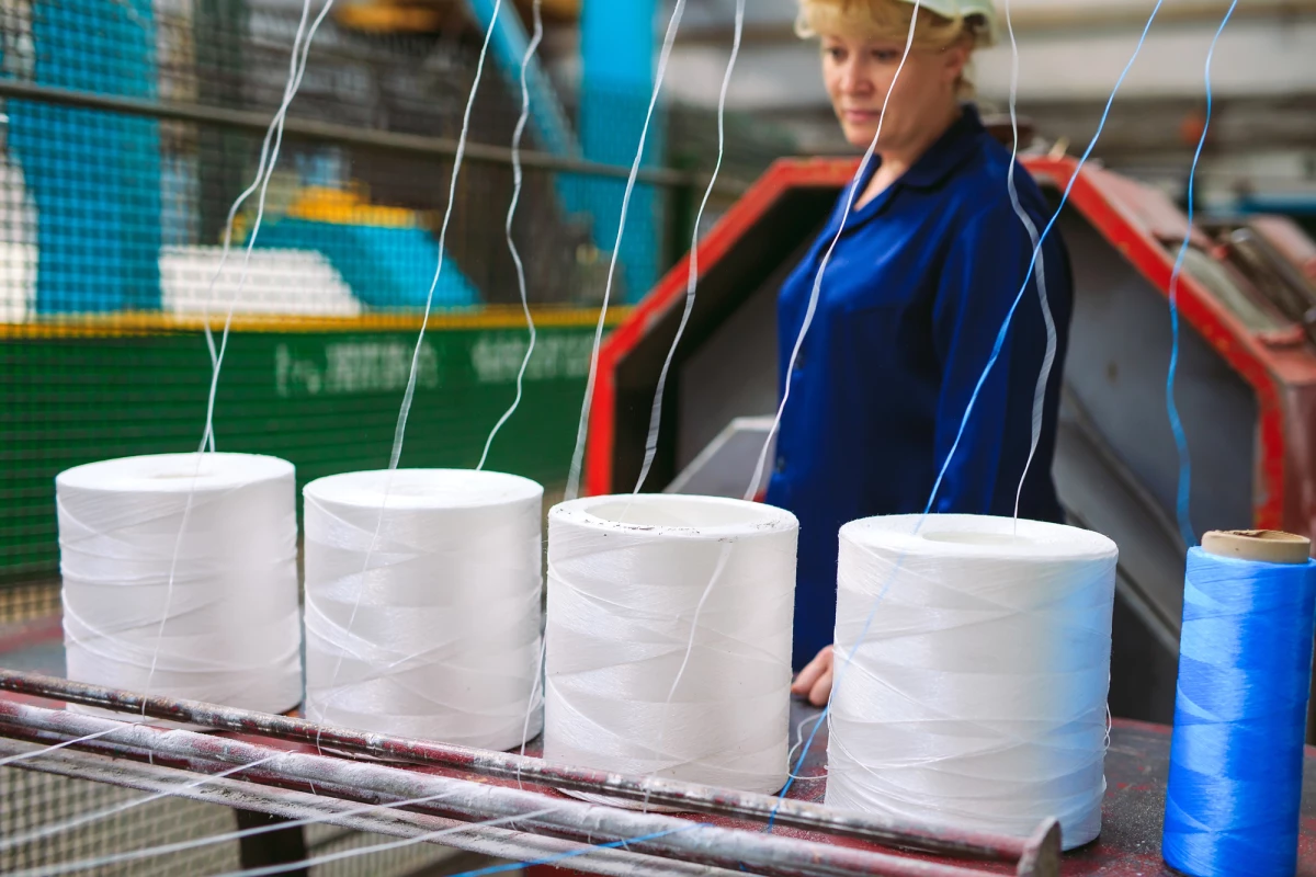 Nylon fibers have a wide range of uses, but current production methods (pictured) create harmful greenhouse gases