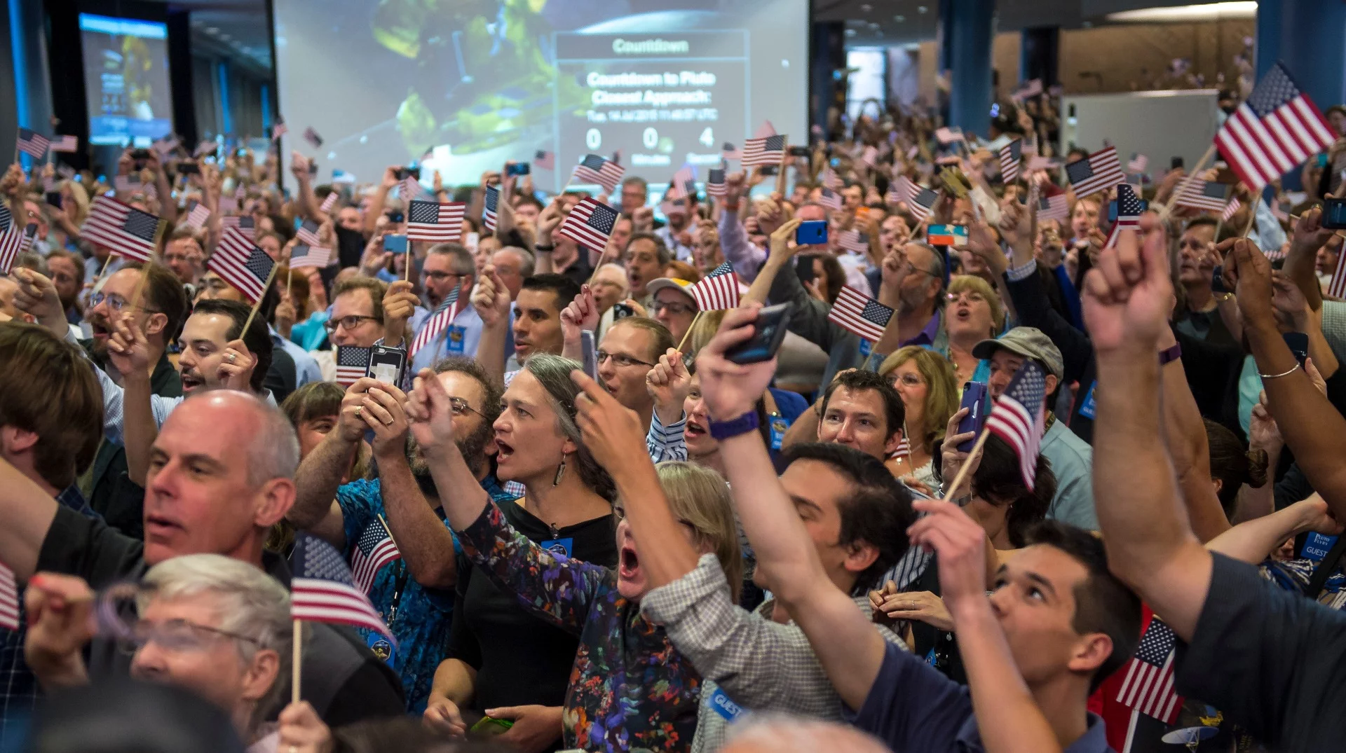 New Horizon team members and guests react to the flyby