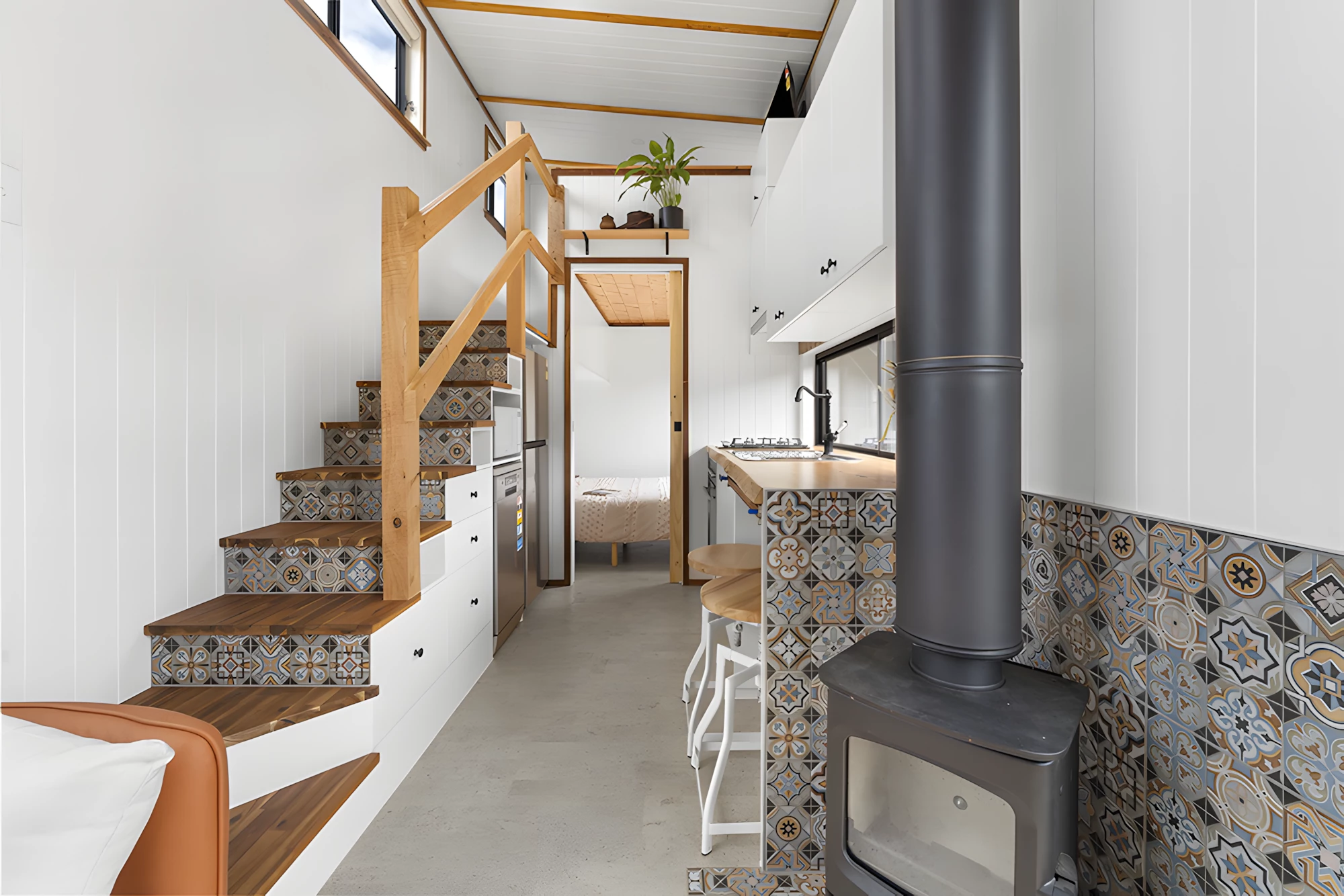 The Grevillea includes a small wood-burning stove for warmth