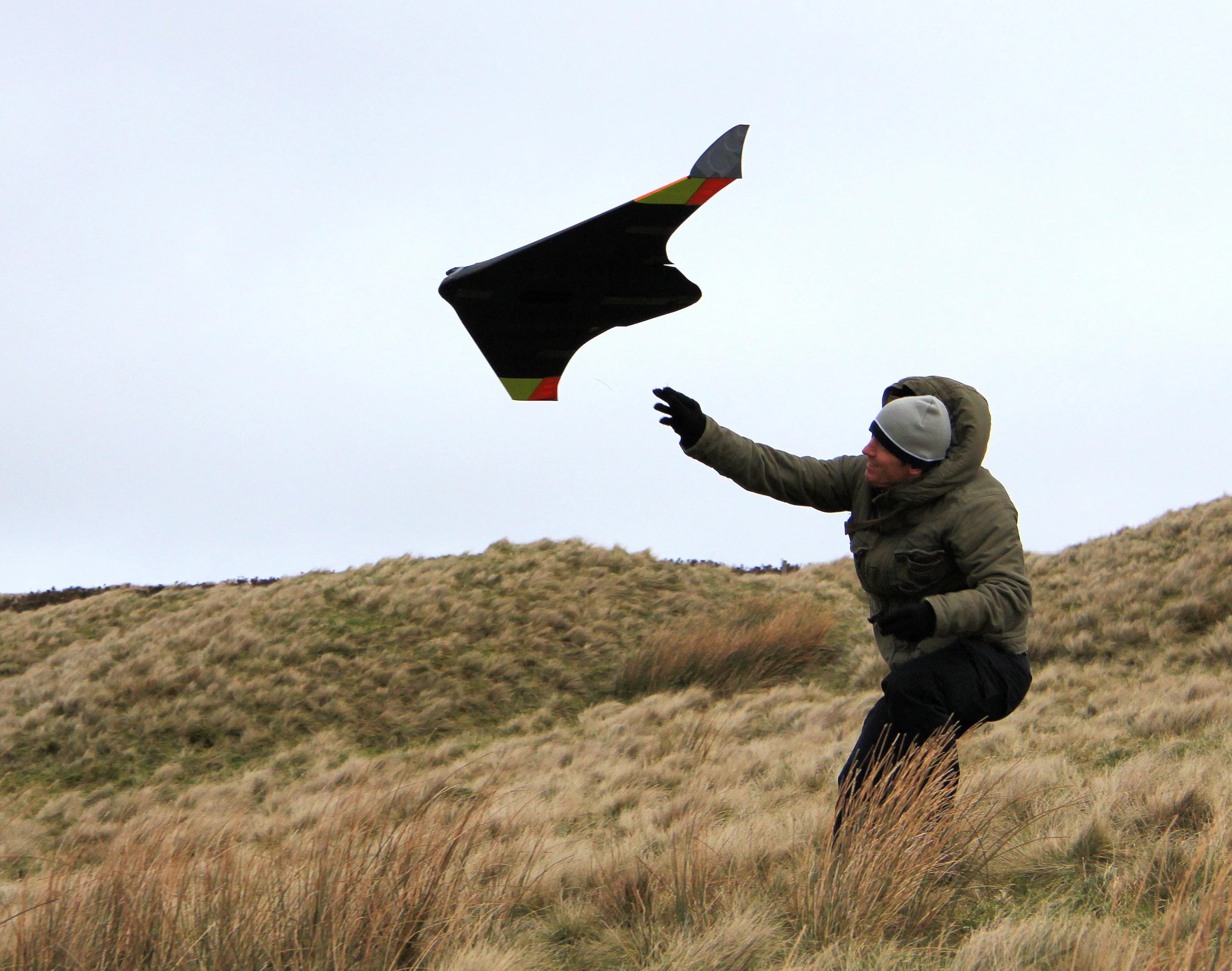 The UAV being hand-launched on its maiden flight