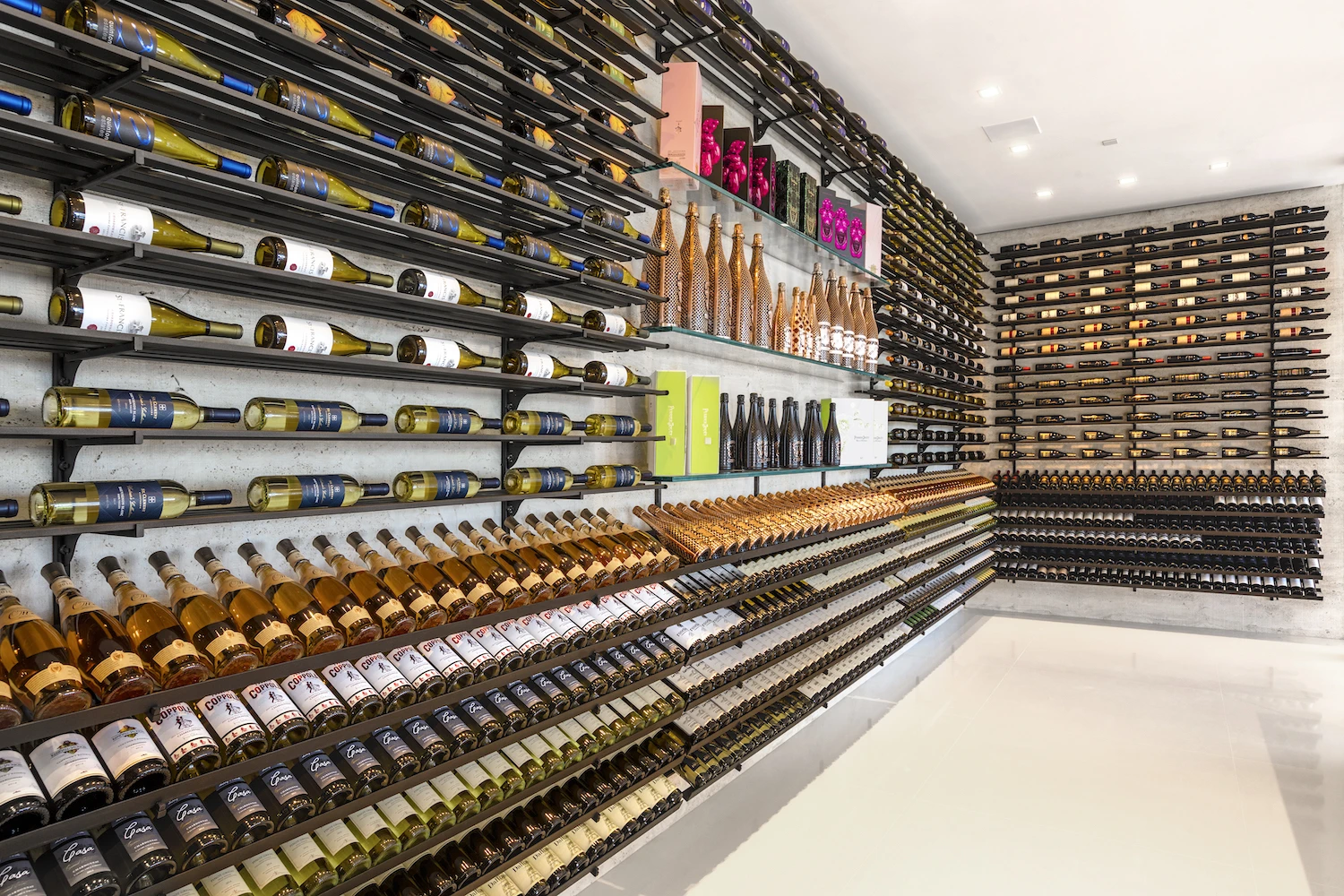924 Bel Air Road boasts a couple of well-stocked champagne and wine cellars