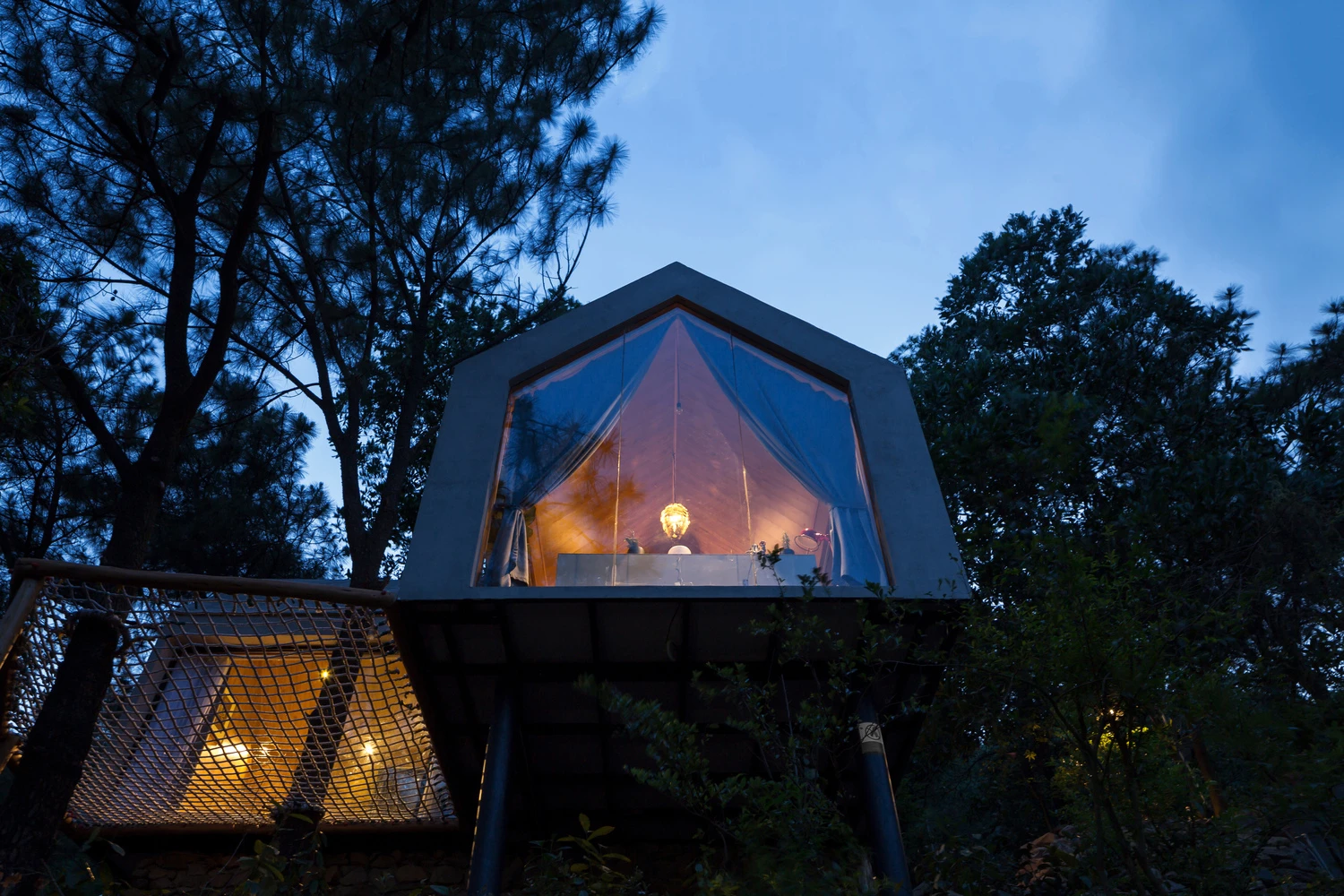 The 45sqm (484.4 sq ft) Forest House 02 rests on two stilts and is built in an L-shape