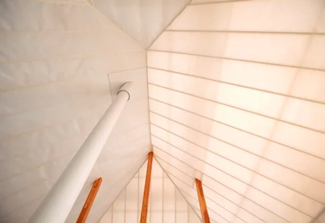 The experimental house construct recalls a barn typology