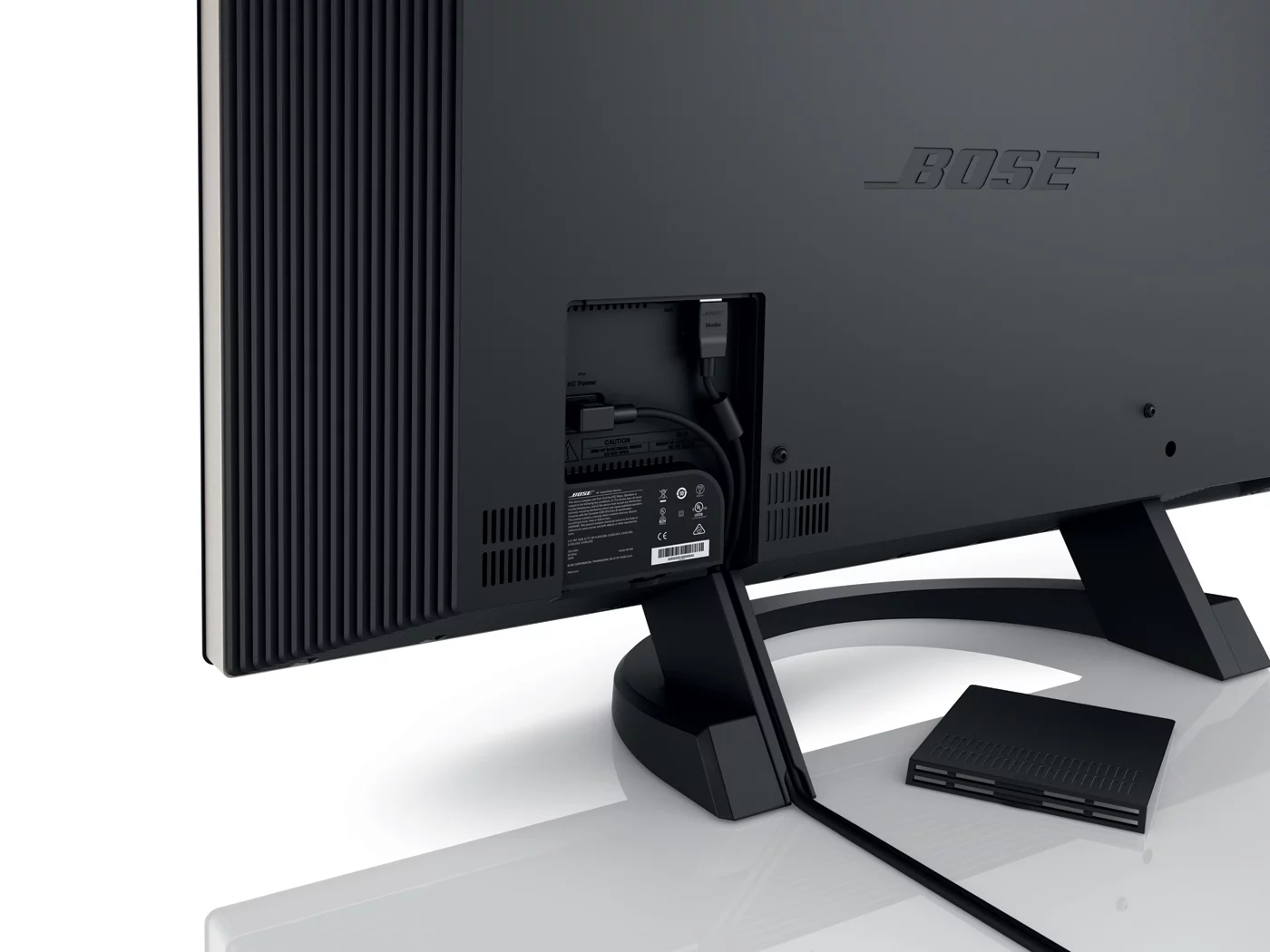 The display is connected to the console by a single cable