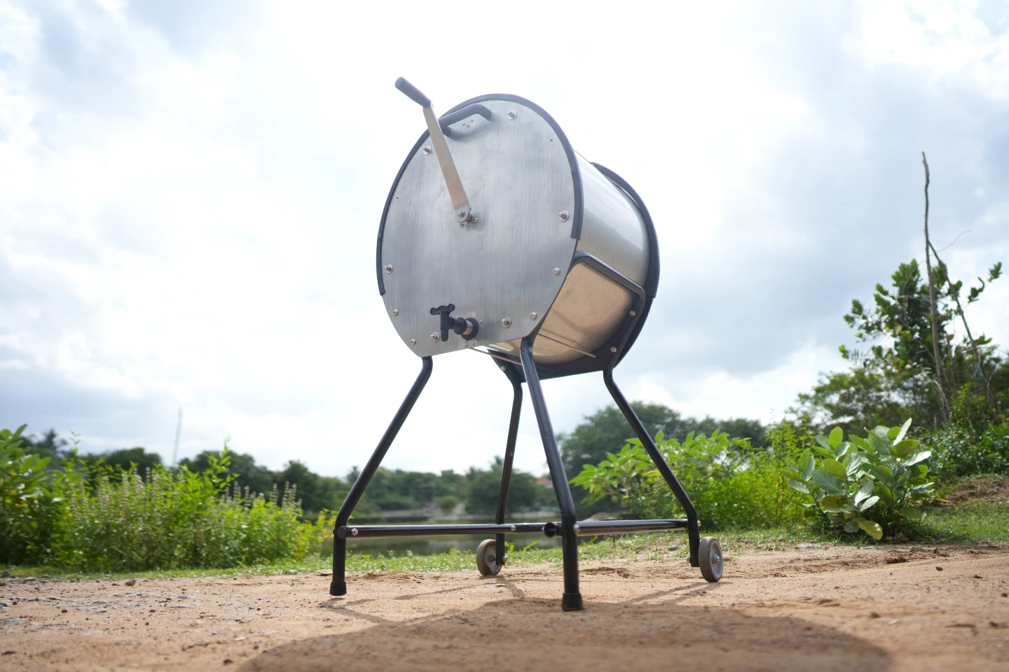 The Divya washing machine is operated by a hand crank, and can be wheeled from one location to another