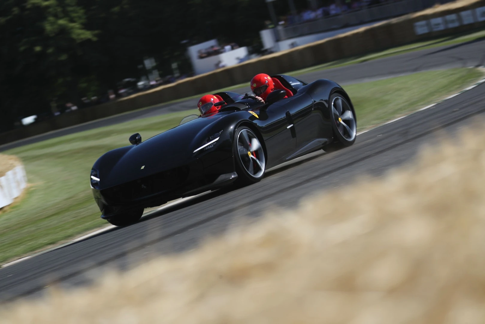 The howl of the V12 Ferrari Monza SP2 set spines tingling all the way up the hill