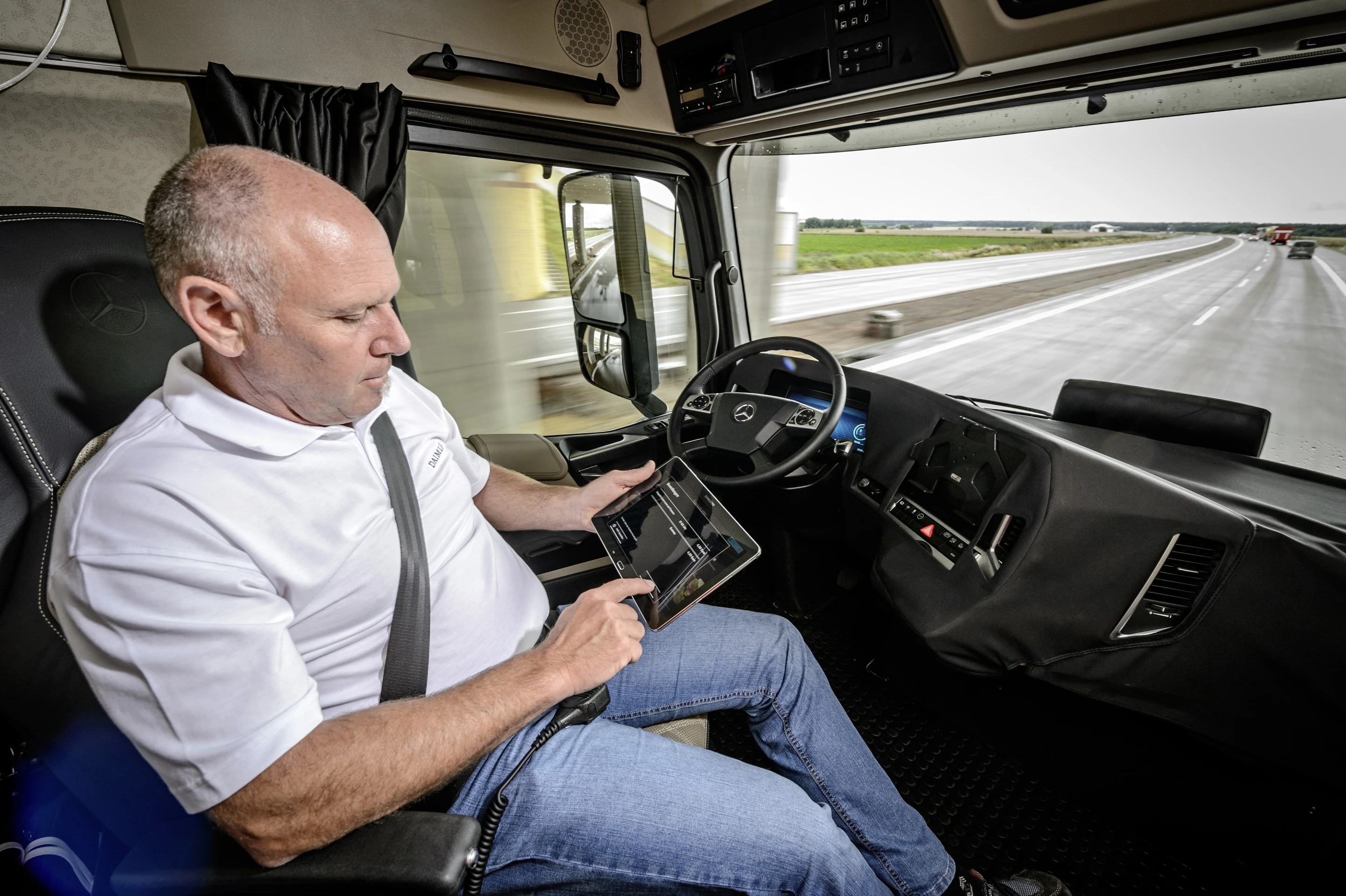 The Daimler autonomous truck uses the tablet to inform the driver