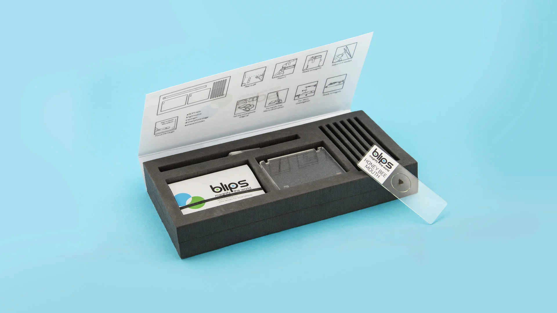 The Blips Lab Kit includes two lenses, two sponges, a light source, a smartphone stage and six prepared slides at which to look