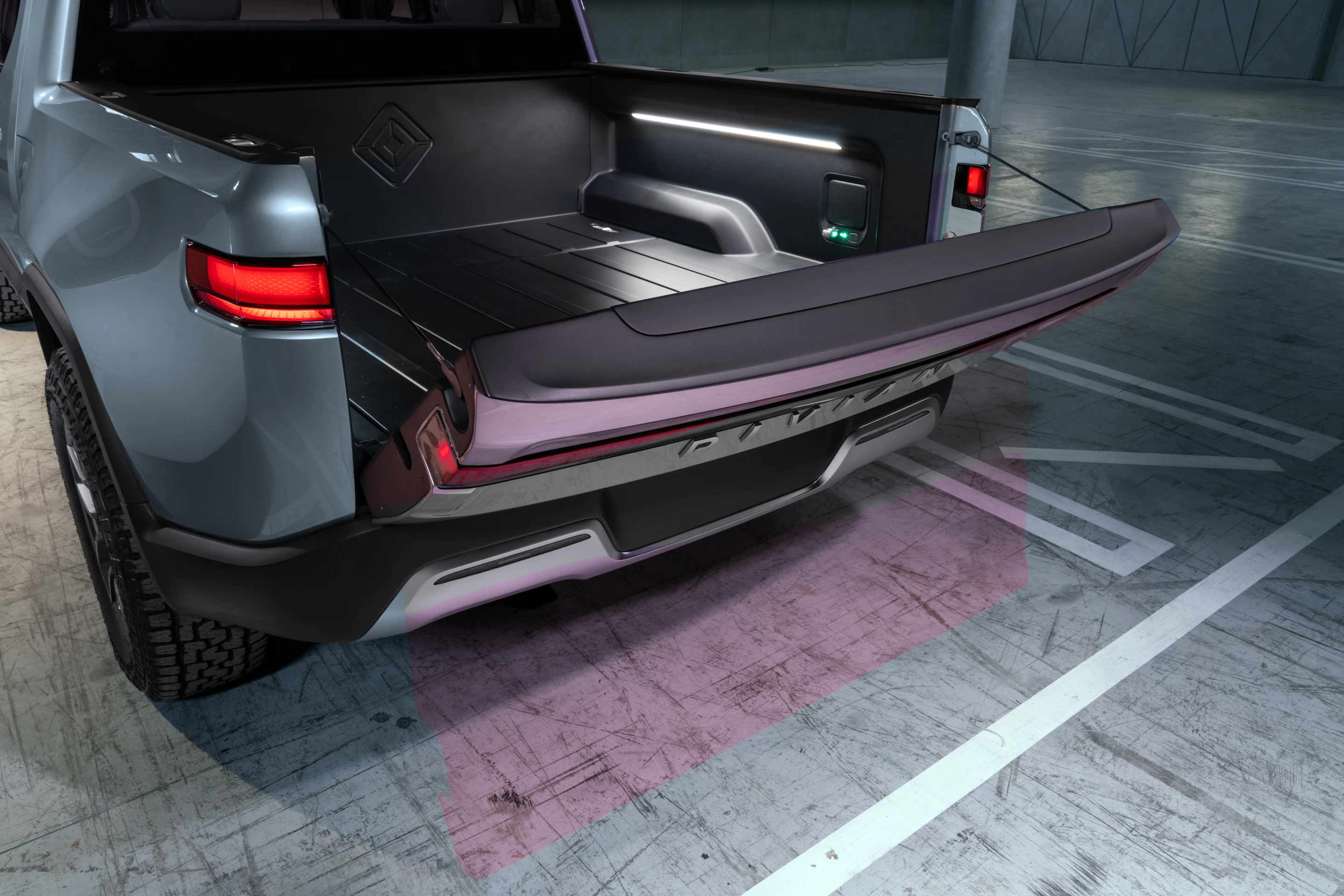 The Rivian bed measures 4.5 feet with the tailgate up