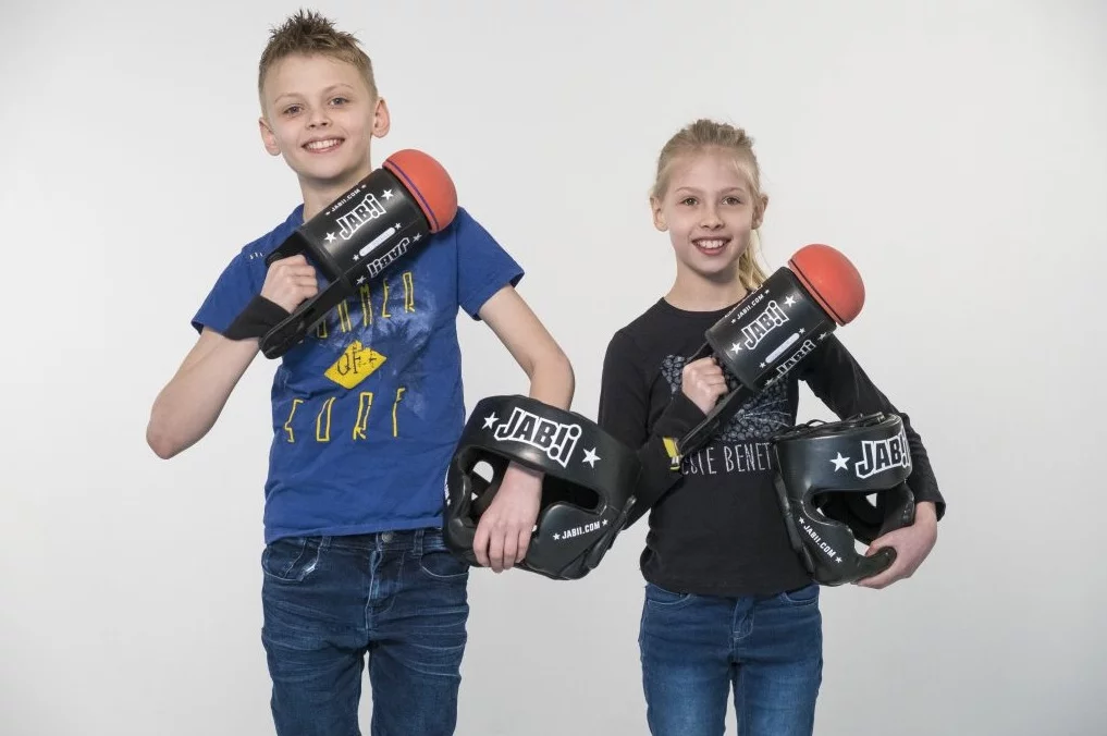 The soft rubber heads and the wrestling-style helmets are designed to make sure Jabbi is safe to play