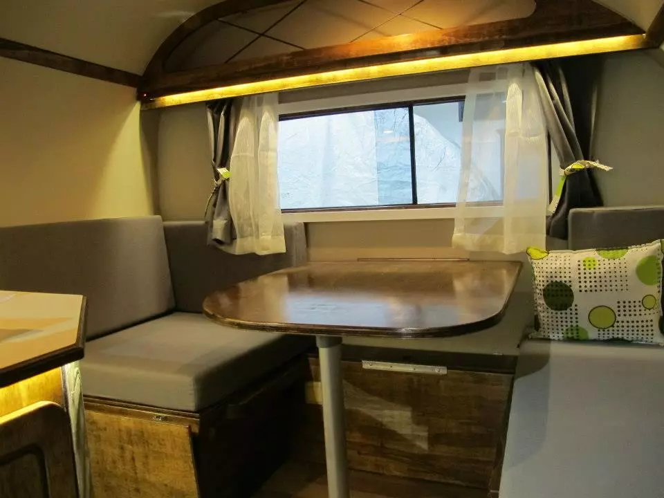 It looks tiny outside, but the Pi2010 packs a kitchen, living area and convertible bed