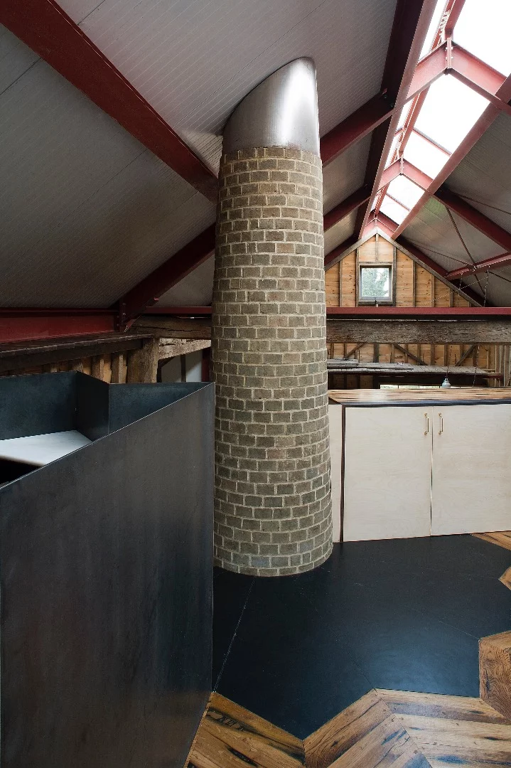 To create definition within the main barn's large interior space, Liddicoat & Goldhill installed a mezzanine