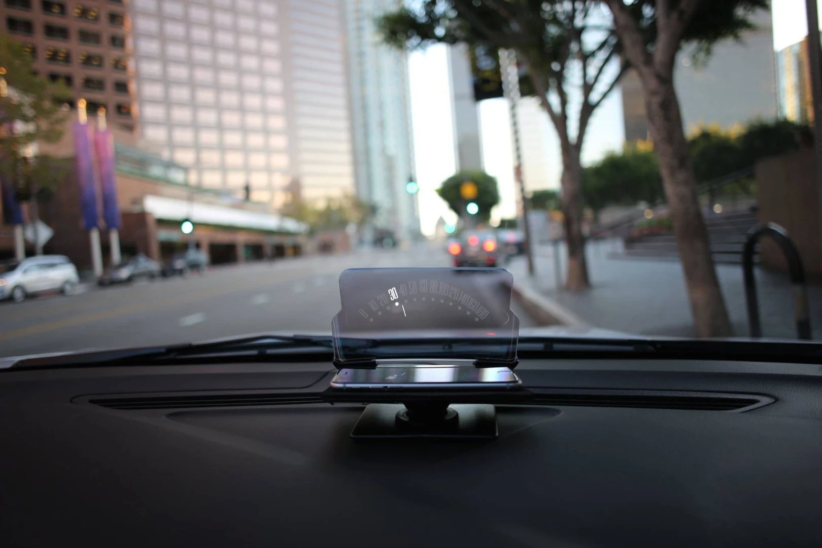 The Hudway Glass sticks to the dashboard via industrial-strength adhesives