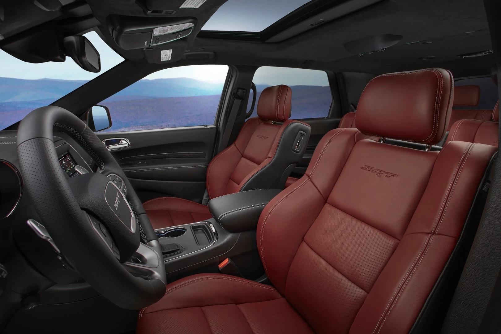 Interior options include this Demonic Red Laguna leather seating and a suede-wrapped headliner. True carbon fiber for the instrument panels is also an option in the Durango SRT