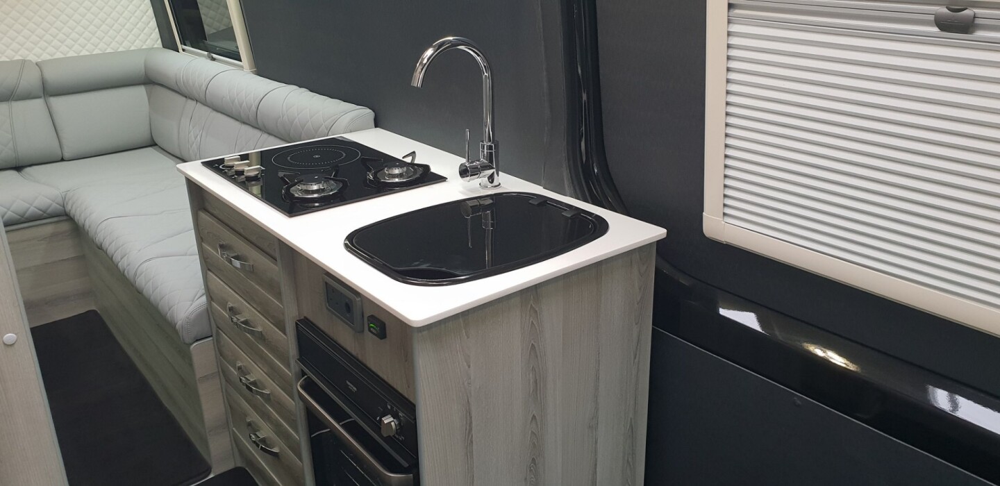 Small but well-equipped, the main kitchen block includes a hybrid induction/gas stove and an oven/grill