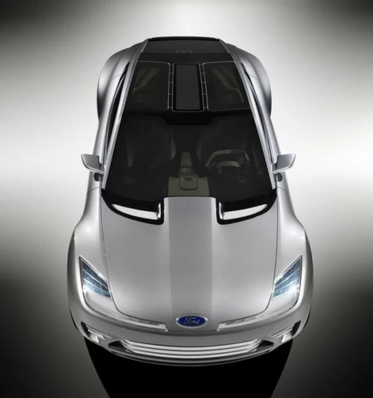 The vehicle's low-voltage circuitry is exposed beneath the glass roof and rear hatch, giving a clever nod to accessible technology – even as a fashion statement.