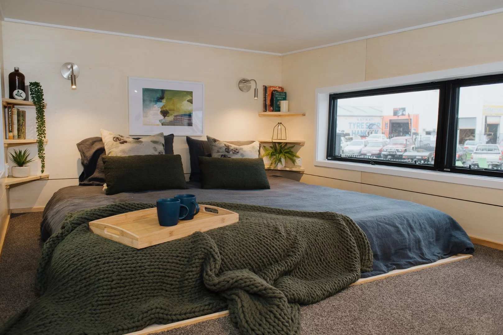 The Green Hill Farm Tiny House's bedroom includes a king-sized bed