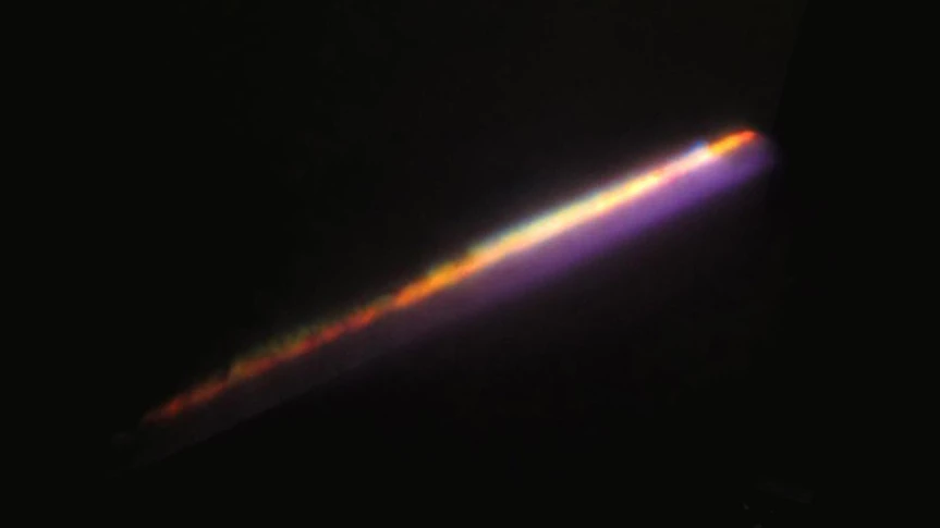 A light pulse fired from a 10 TW laser, dispersing into water vapor – the blue glow is laser light and the source of the other colors is mainly plasma filament arising as a result of ionized matter (Photo: IPC PAS)