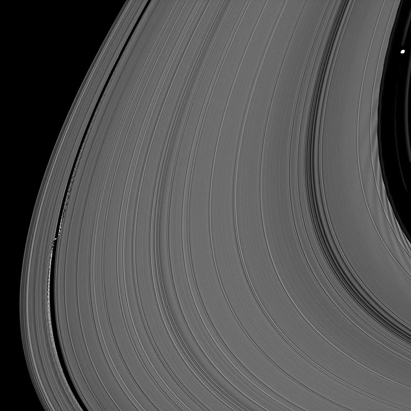 The density rings in Saturn's A ring caused by a team of moons look like grooves in a vinyl record