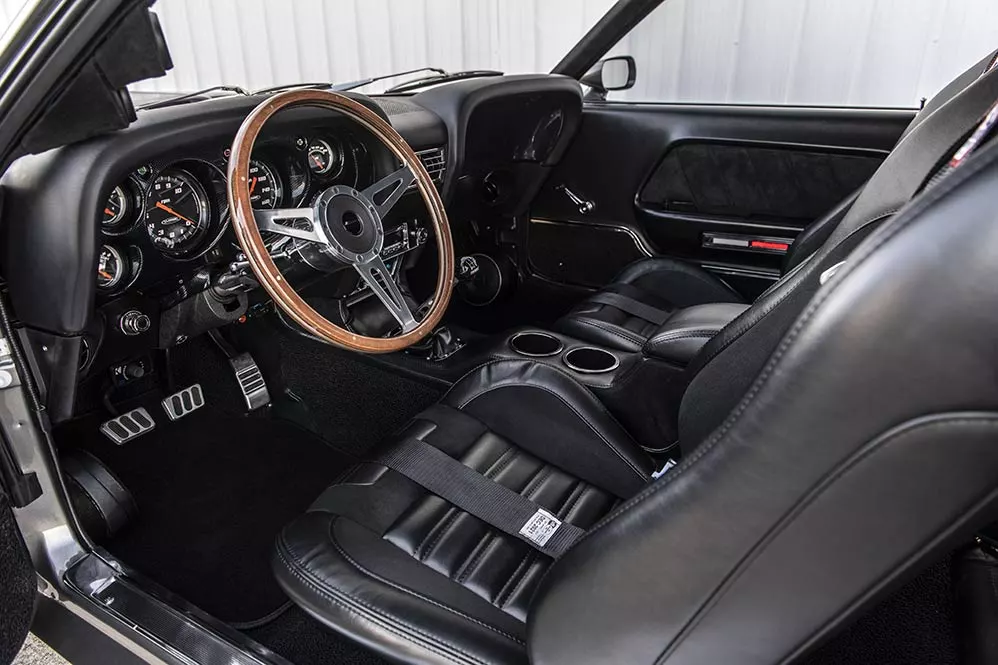 The interior of the Mustang Mach 1 Hitman includes period-reproduction seating, customized instruments, and other details