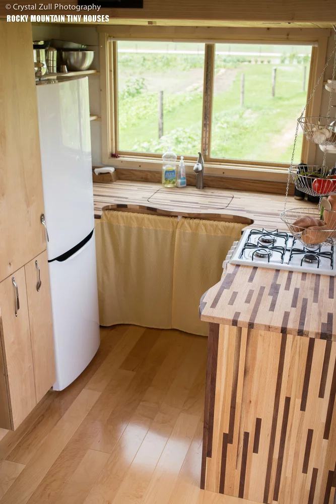 The kitchen boasts a full-size fridge freezer