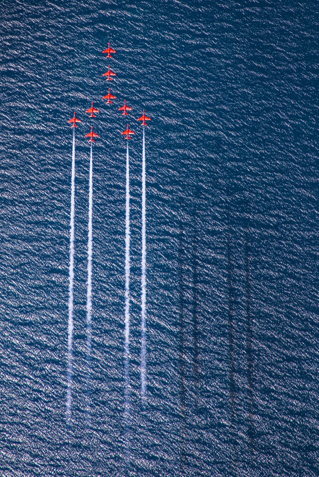 Winner of the RAF Image of the Year. The Royal Air Force Aerobatic Team, the Red Arrows perform Concorde over the deep blue sea of Greece.