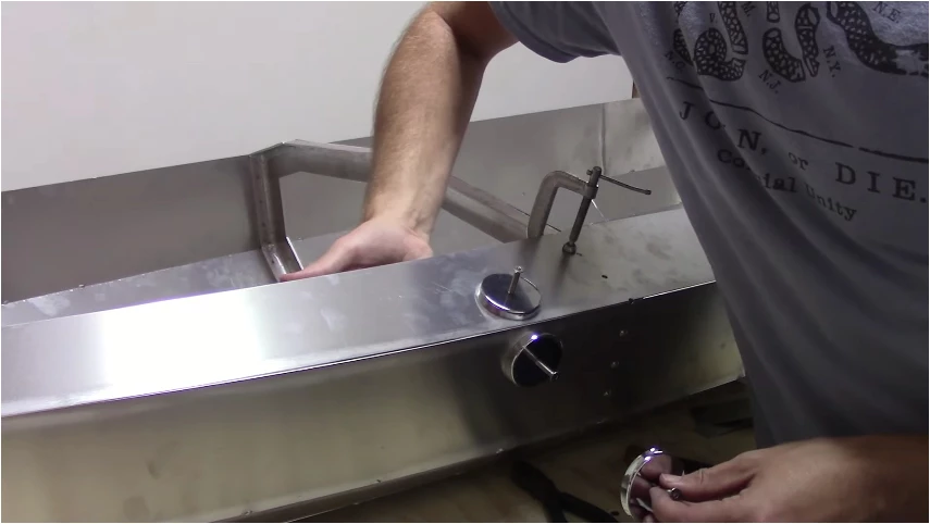 Kunka used a door hinge and magnets to keep some of the aluminum panels aligned for welding
