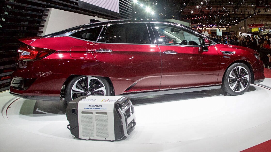 The Honda Clarity Fuel Cell is seen here with its compact Power Exporter 9000 unit for powering homes or offices in emergencies
