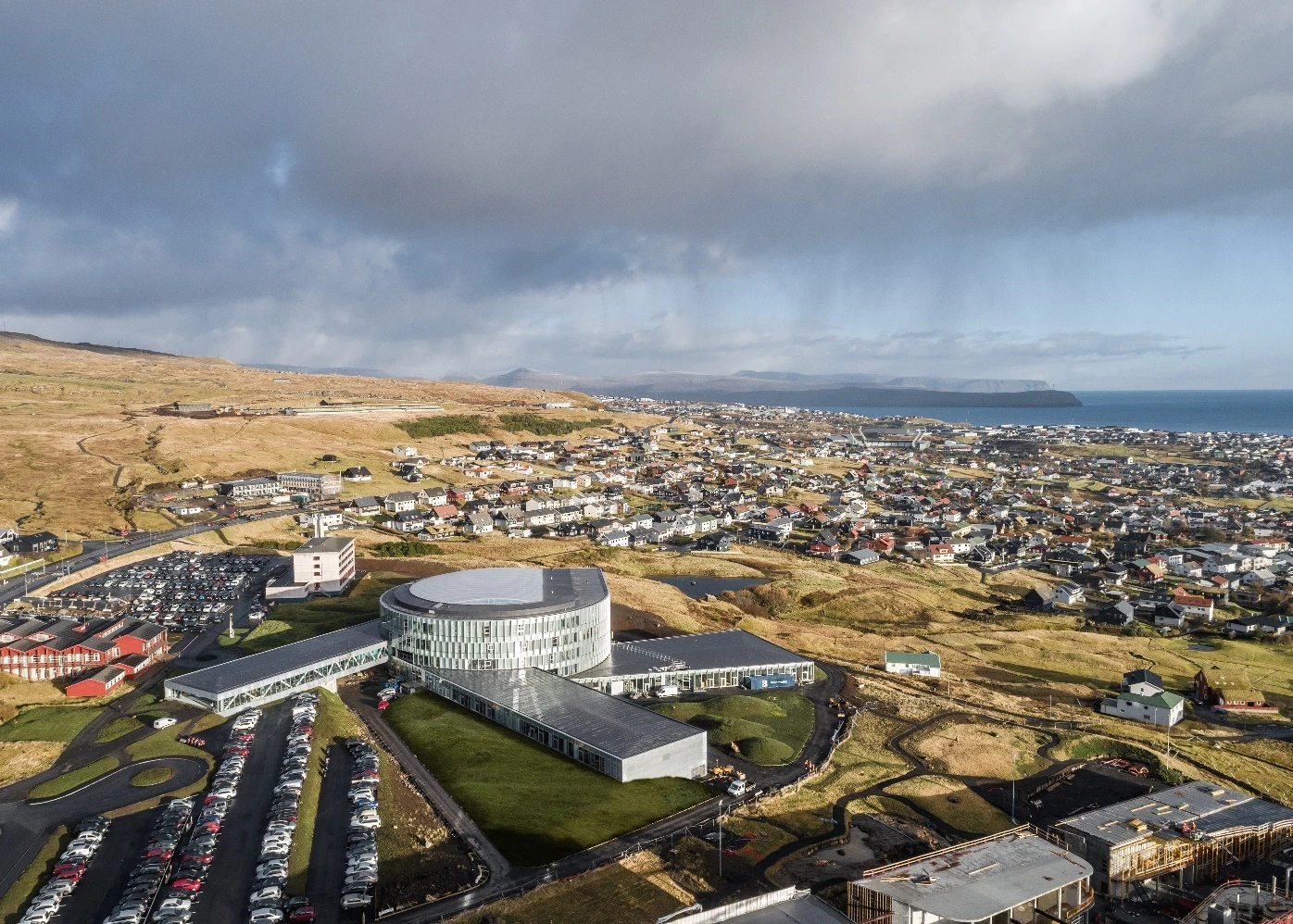 Grass planted on Glasir's roofs will eventually cover it in green and help the building blend in with the landscape more fully