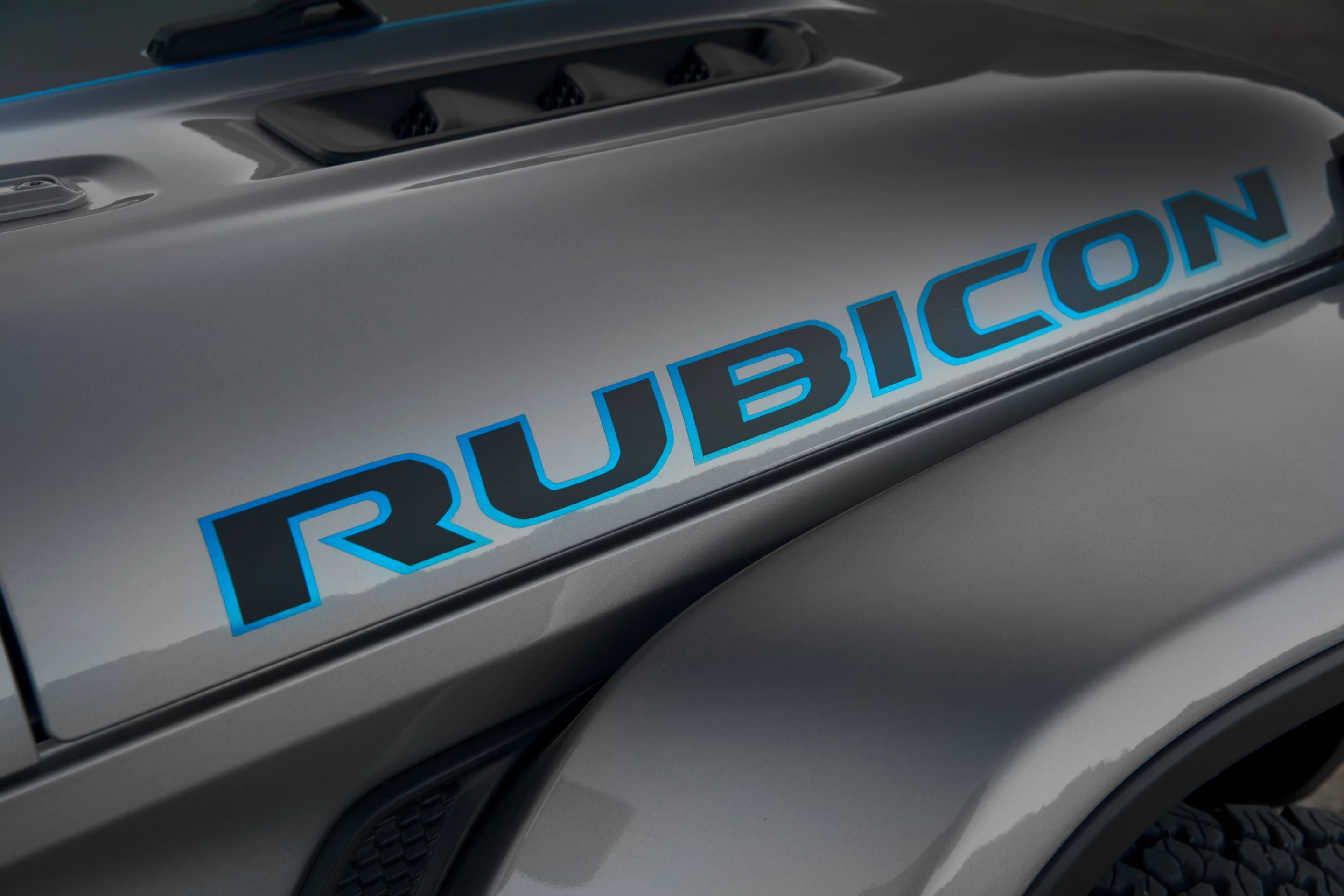 Surf Blue accents the Rubicon graphic on the hood of the 2021 Jeep Wrangler 4xe denote its electrified nature