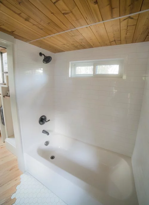 The Legacy tiny house features a full-size tub and shower, certainly a luxury item in the world of tiny house living