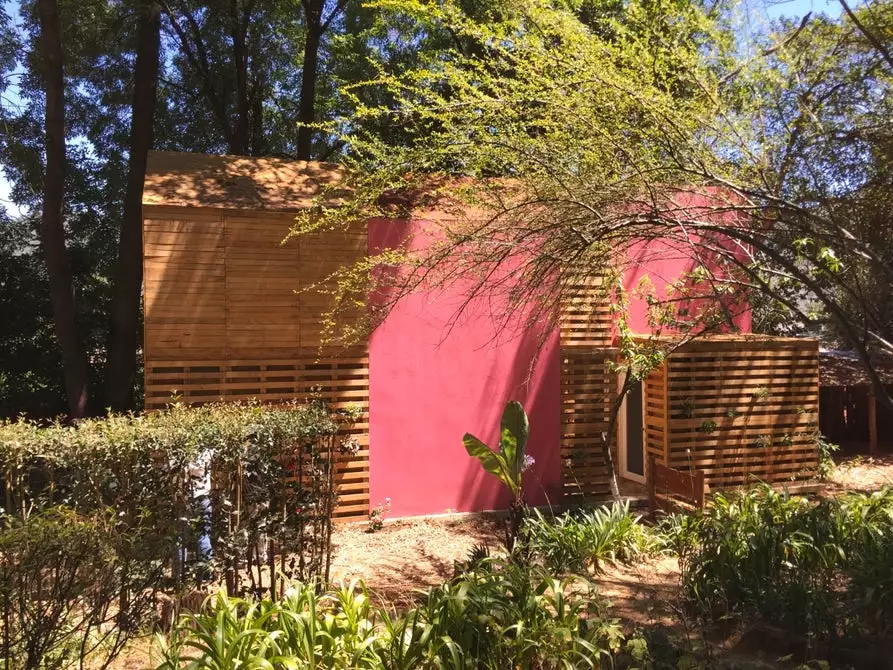 The pallets making up this low-cost home by Mexican Architect Tatiana Bilbao allow relatively easy expansion and alteration, and they're also used instead of windows to offer natural light and ventilation in suitable areas of the home