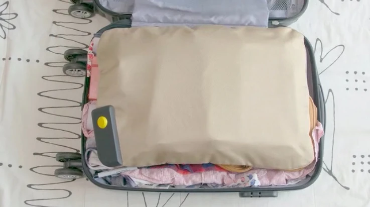 PaQ consists of a main device (lower left, in suitcase) that's attached to an inflatable bladder