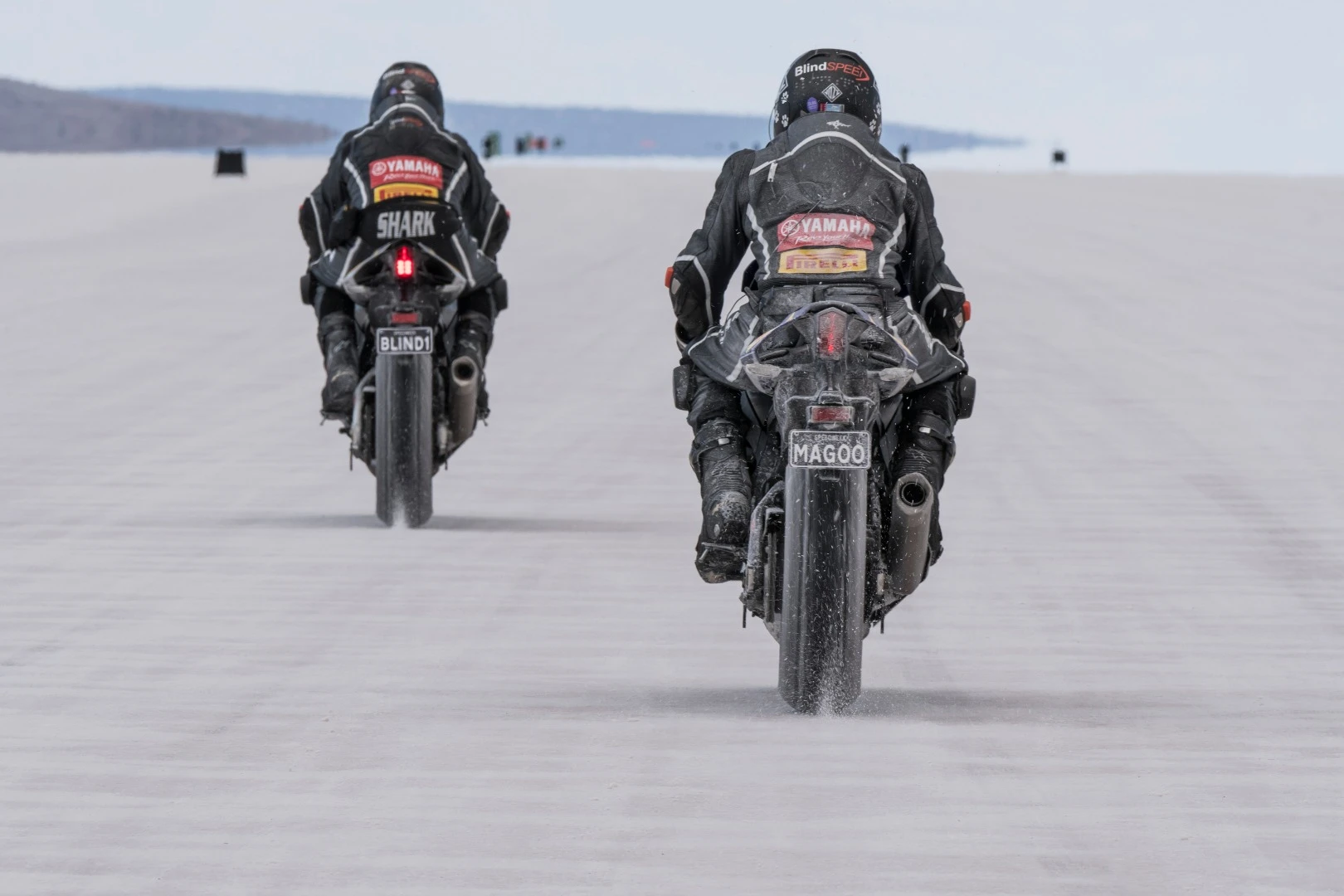 Ex-MotoGP racer Kevin Magee rides behind Felten as he sets the record in 2017