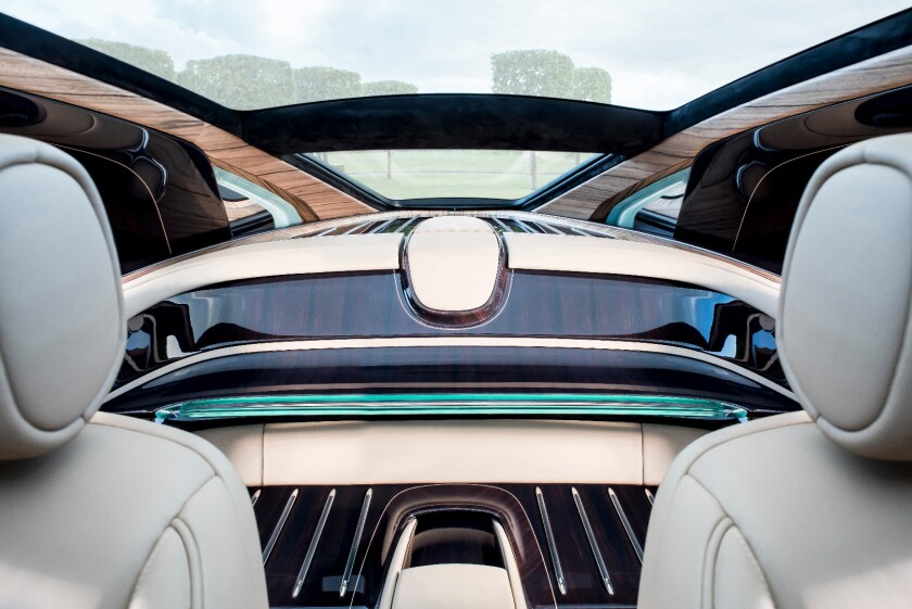 The rear seats have been ripped out of the Sweptail, and a wooden luggage area have been included in their place
