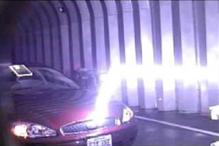 A lightning bolt travels horizontally down a plasma channel from the LIPC before deviating when it gets close to the target which offers a lower-resistance path to the ground (Photo: U.S. Army)